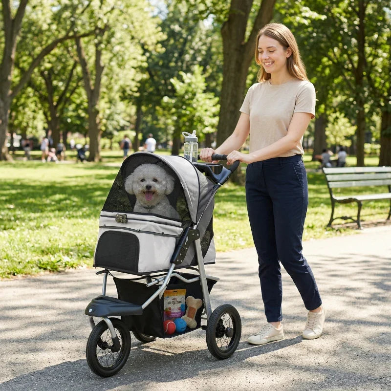 Compact All-Terrain Pet Stroller with mesh canopy and small white dog inside four-wheel frame on Tampa Home & Garden Store