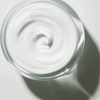 Esthederm anti-aging face cream in a clear glass jar with swirled white cream on Tampa Home & Garden Store