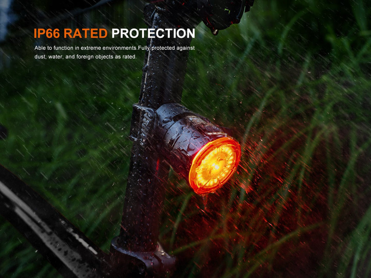 Fenix BC06R Smart-Brake bicycle taillight mounted on bar with orange-red LED glow IP66 on Tampa Home & Garden Store