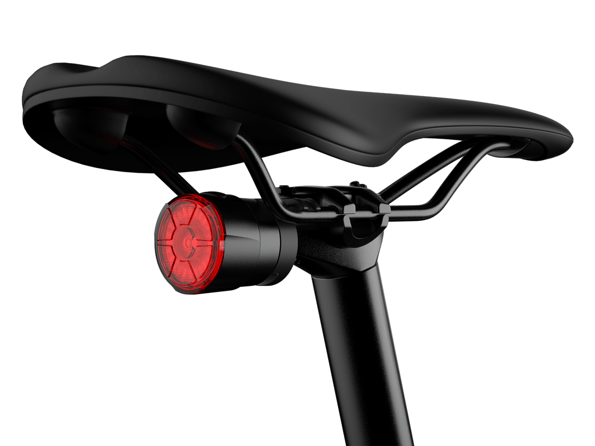 Fenix BC06R Smart-Brake bicycle taillight mounted under black saddle with red lens on Tampa Home & Garden Store