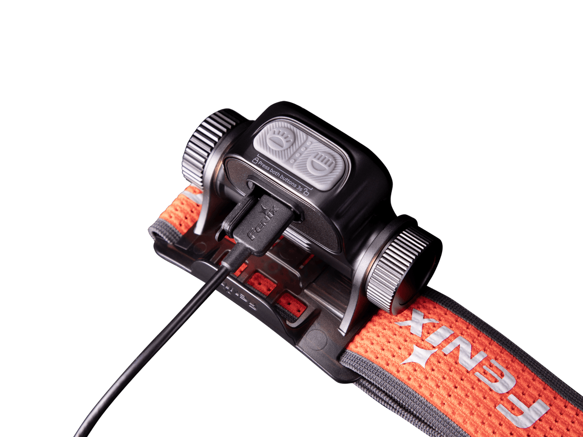 Fenix HM65R-T V2 headlamp with orange strap, grey dual buttons, USB-C cable on Tampa Home & Garden Store