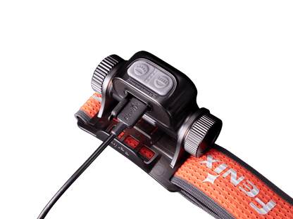 Fenix HM65R-T V2 headlamp with orange strap, grey dual buttons, USB-C cable on Tampa Home & Garden Store