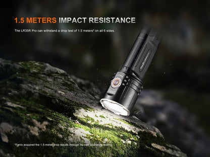 Fenix LR35R PRO handheld searchlight black anodized body with rotary dial on mossy rock on Tampa Home & Garden Store
