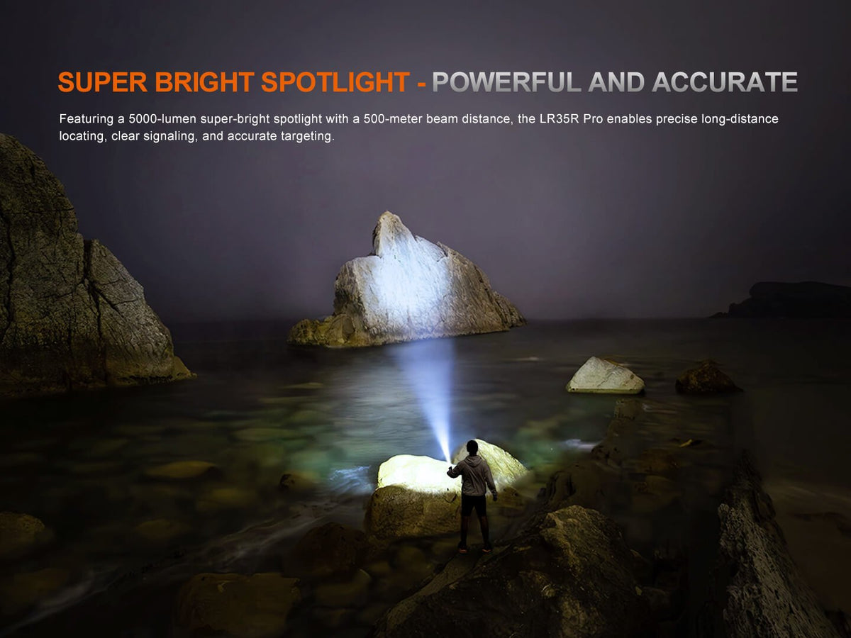 Fenix LR35R Pro rechargeable palm sized searchlight lighting a rocky shore at night with a person on Tampa Home & Garden Store