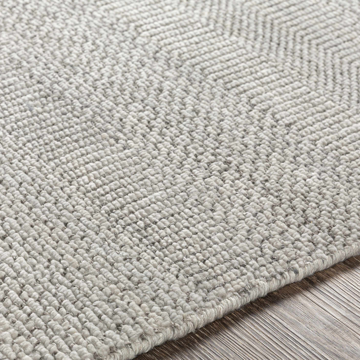 Ocate gray wool area rug by Boutique Rugs; close-up of textured gray loop pile on Tampa Home & Garden Store