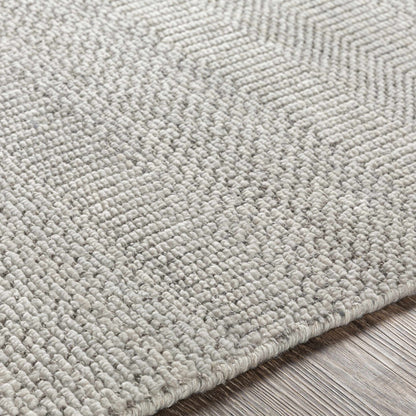 Ocate gray wool area rug by Boutique Rugs; close-up of textured gray loop pile on Tampa Home & Garden Store