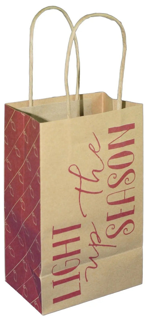 Kraft paper gift bag with twisted handles, red side panel and Light Up the Jr Cub text on Tampa Home & Garden Store