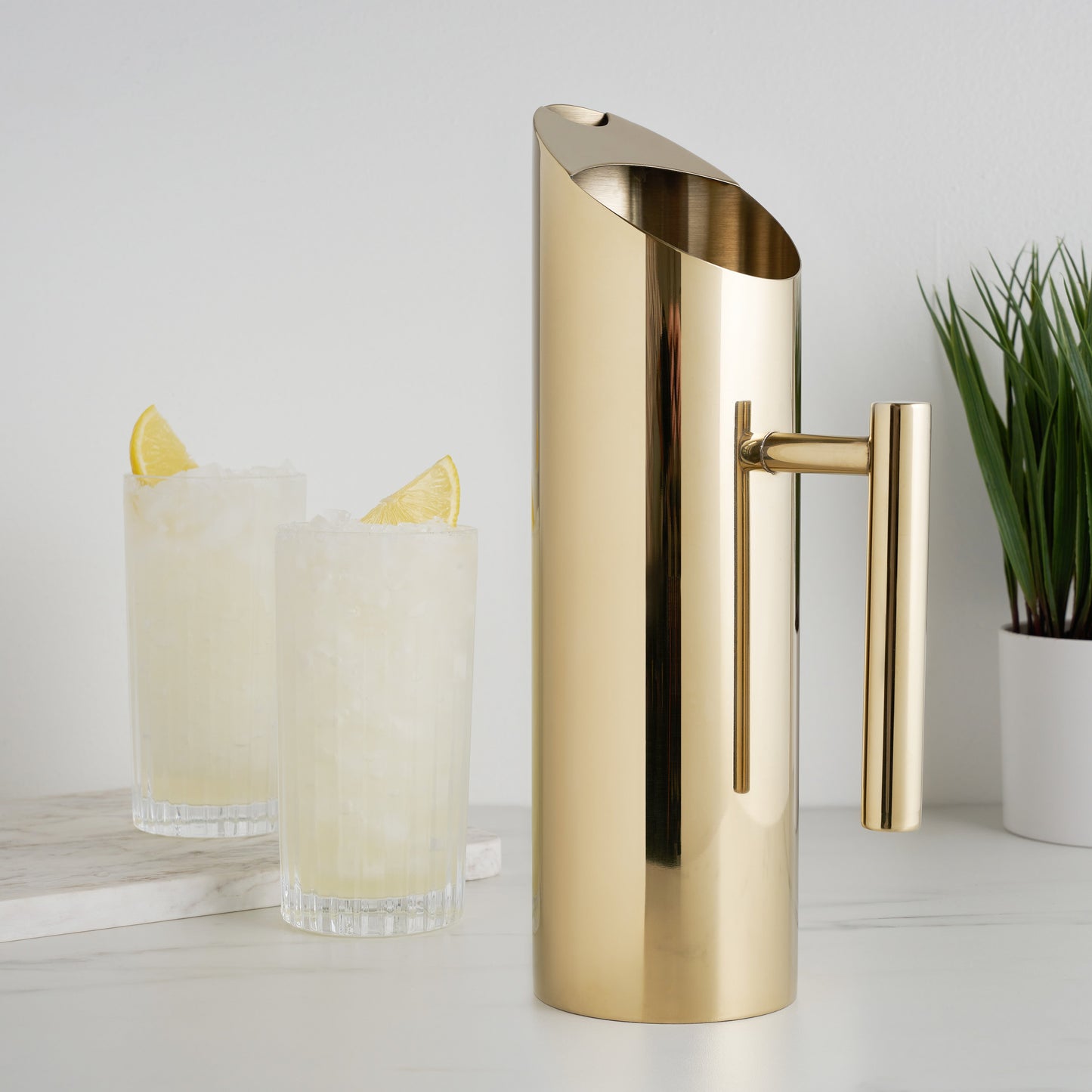 Modern Stainless Steel Pitcher With a Gold Tone