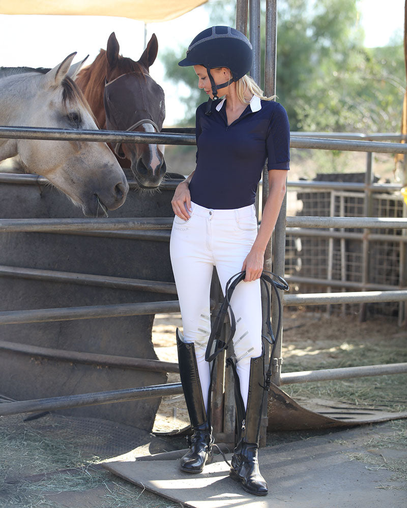 OLIVIA Show Shirt by BellEq Equestrian Apparel worn by rider in navy polo with white breeches on Tampa Home & Garden Store