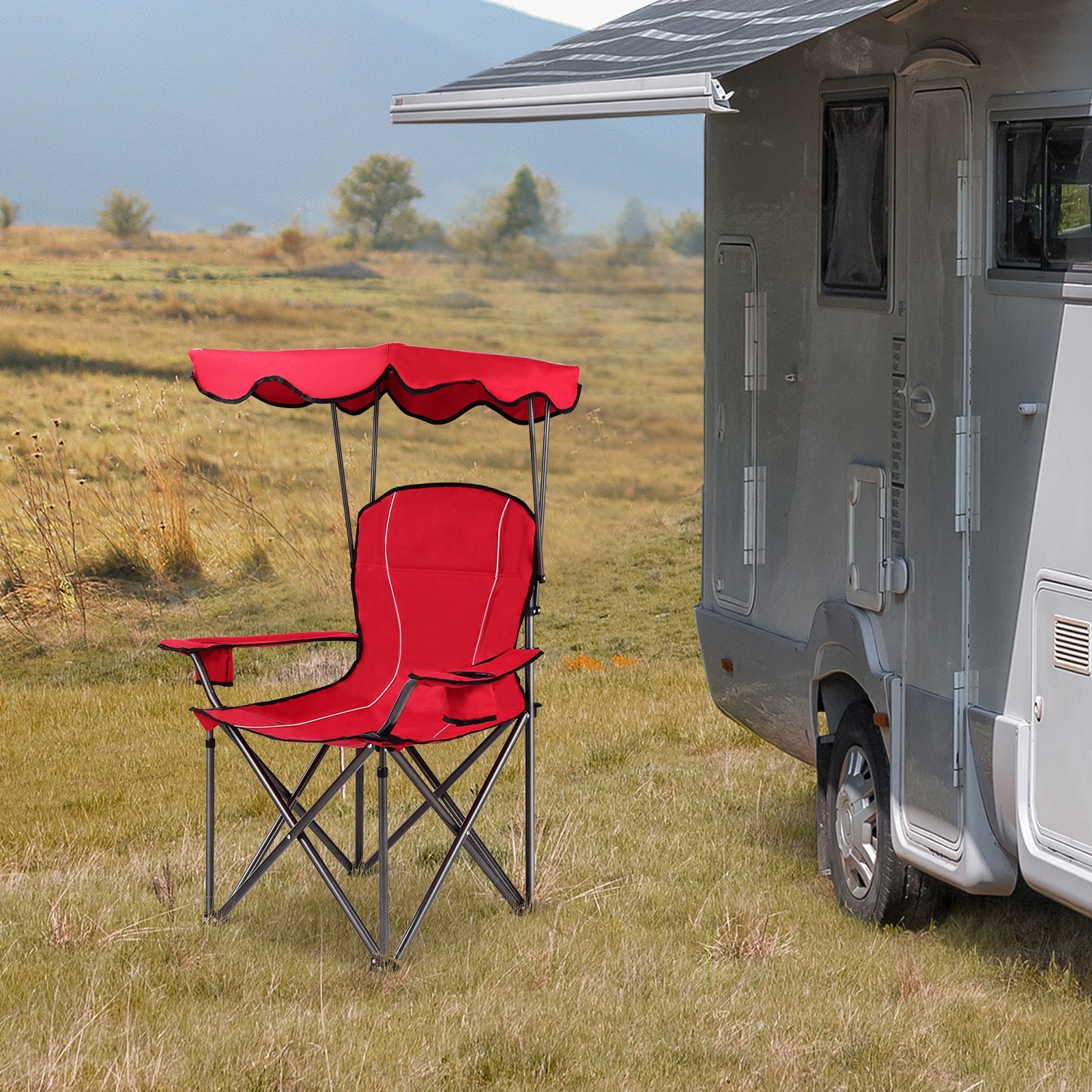 Red folding camping chair with scalloped canopy beside a gray RV in a field on Tampa Home & Garden Store