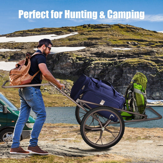Larger Capacity Folding Deer Game Cart with blue duffel and green pack on camping terrain on Tampa Home & Garden Store