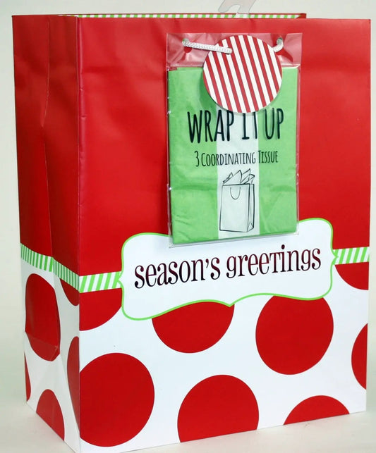 Gift bag with red dot large and green tissue insert season's greetings label on Tampa Home & Garden Store
