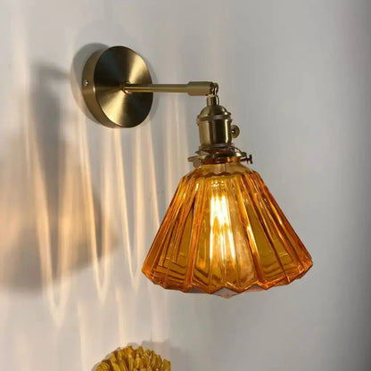 Orange and Gold Fluted Glass Wall Lamp in Bedroom