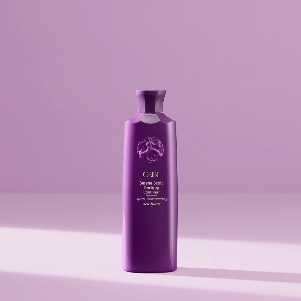 Oribe Serene Scalp Densifying Conditioner bottle in purple with embossed logo on Tampa Home & Garden Store