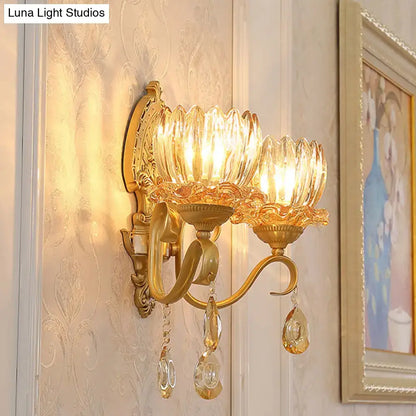 Decorbites brass lotus wall sconce with twin amber shades and crystal drops on a gold backplate on Tampa Home & Garden Store