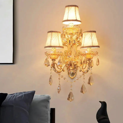 Ornate gold crystal 3-light metal living room sconce Decorbites with hanging prisms on Tampa Home & Garden Store
