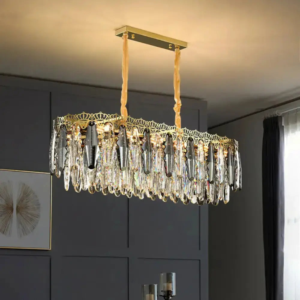 Ornate gold leaf pendant light for bedroom with prisms and leaf trim, two beige cords on Tampa Home & Garden Store