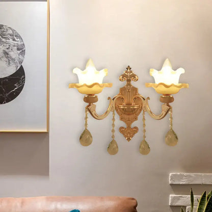 Gold frosted glass dual-bulb sconce with ornate brass arms and crystal teardrops Decorbites on Tampa Home & Garden Store