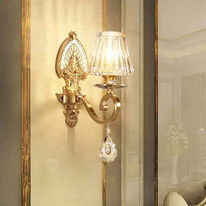 Gold crystal prismatic wall sconce with ornate backplate and crystal shade on Tampa Home & Garden Store