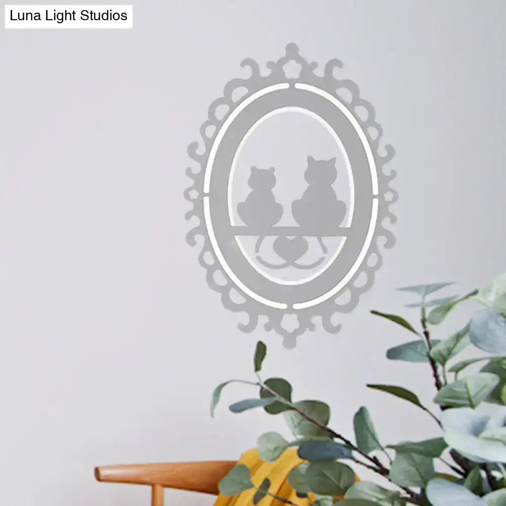 Gray cat wall light by Decorbites with ornate oval frame and two cat silhouettes on a shelf on Tampa Home & Garden Store