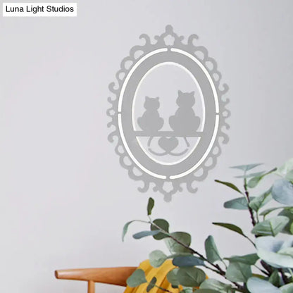 Gray cat wall light by Decorbites with ornate oval frame and two cat silhouettes on a shelf on Tampa Home & Garden Store