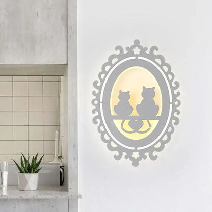 Gray cat wall light by Decorbites with a framed two-cat silhouette and warm glow on Tampa Home & Garden Store