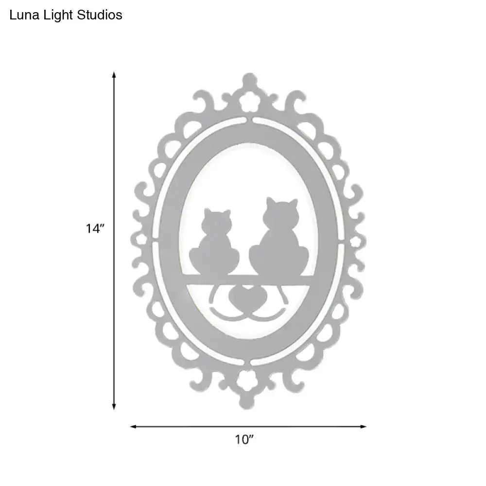 Gray cat wall light with ornate oval frame and two cat silhouettes by Decorbites on Tampa Home & Garden Store