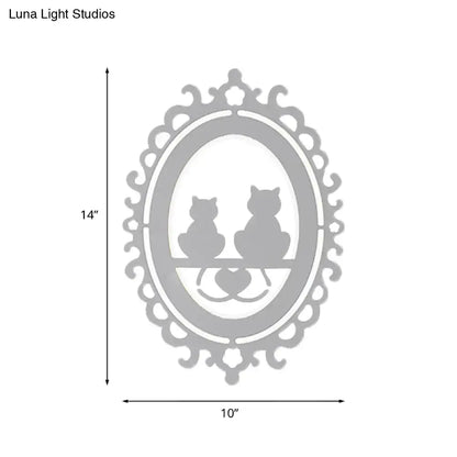 Gray cat wall light with ornate oval frame and two cat silhouettes by Decorbites on Tampa Home & Garden Store