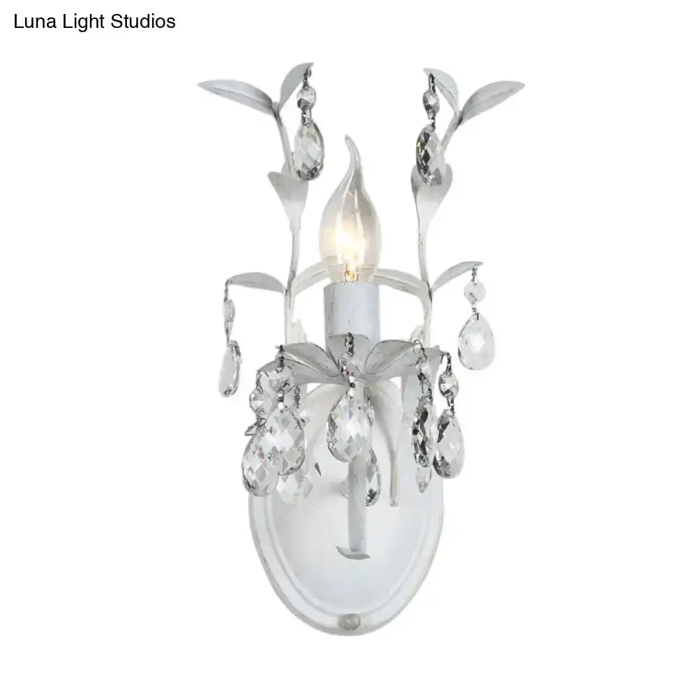 Ornate silver crystal leaf wall sconce by Decorbites with hanging prisms on Tampa Home & Garden Store
