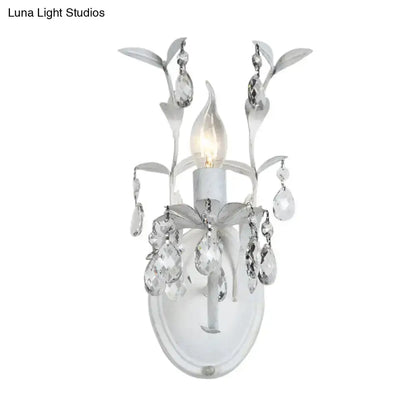 Ornate silver crystal leaf wall sconce by Decorbites with hanging prisms on Tampa Home & Garden Store