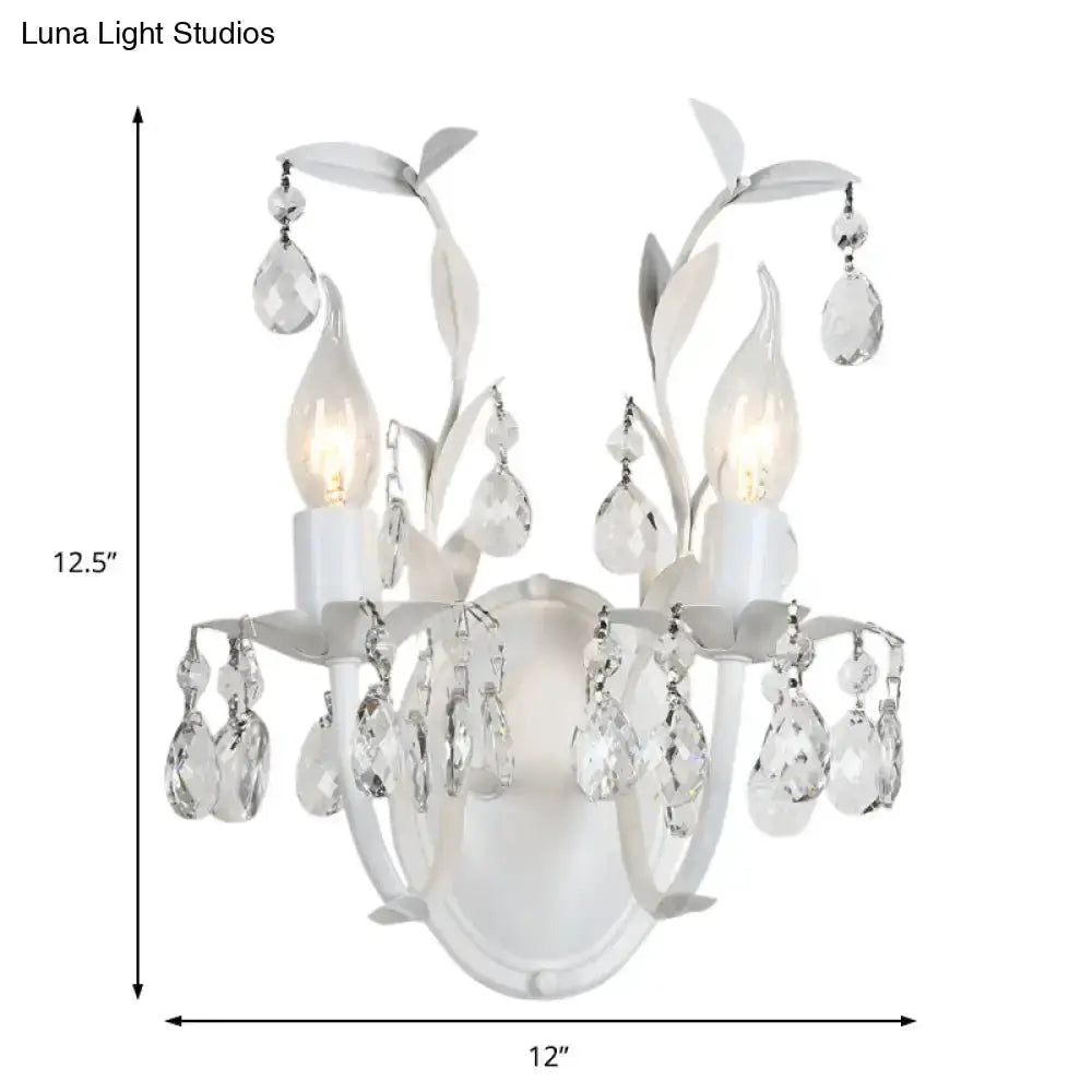 Ornate silver crystal leaf wall light fixture sconce by Decorbites with hanging prisms on Tampa Home & Garden Store