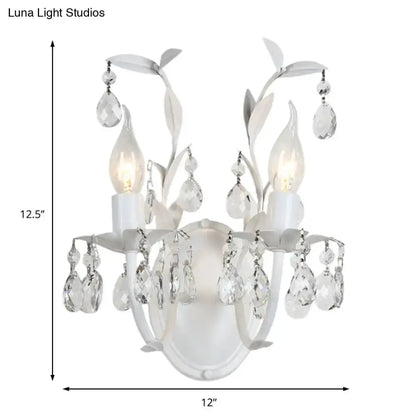 Ornate silver crystal leaf wall light fixture sconce by Decorbites with hanging prisms on Tampa Home & Garden Store