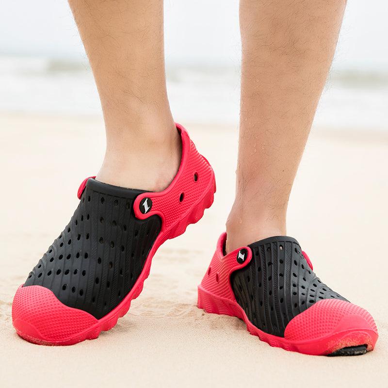 Stevvex men's outdoor sandals black and red perforated rubber clogs pair on beach on Tampa Home & Garden Store