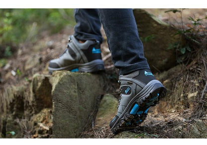 Stevvex men's hiking boots with gray upper and blue accents and non-slip outsole on trail on Tampa Home & Garden Store