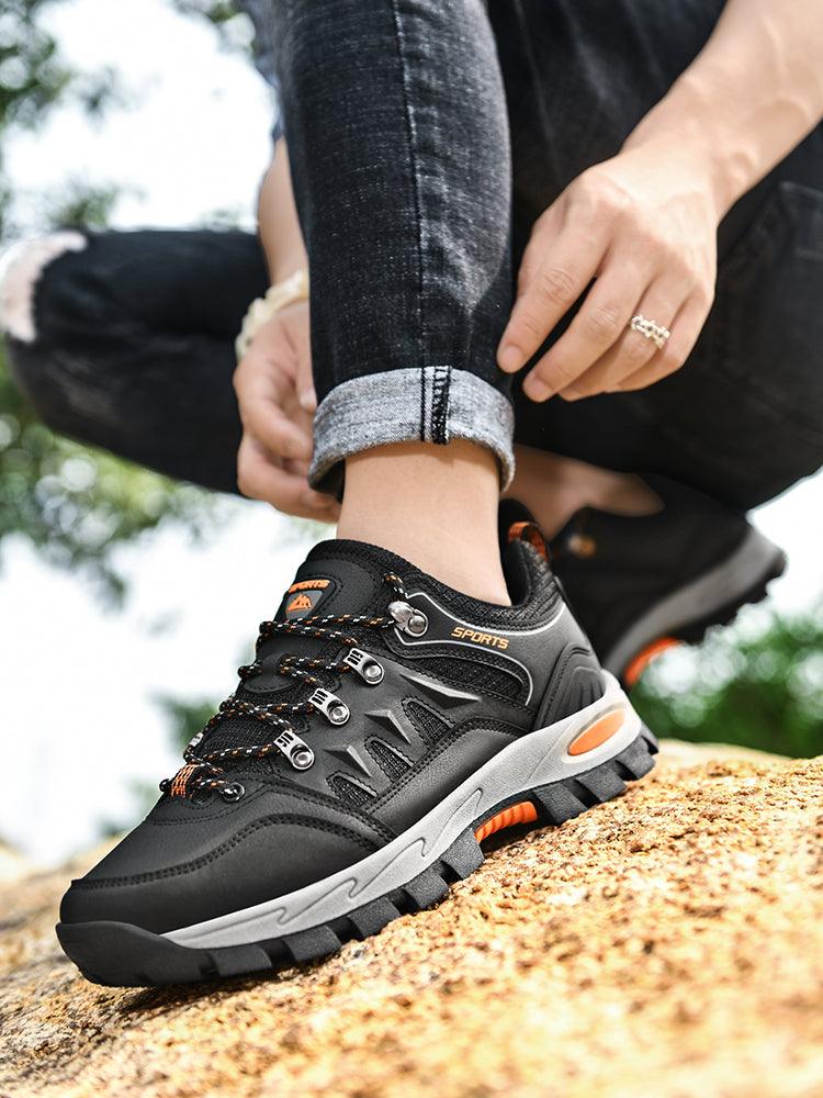 Stevvex waterproof hiking boot black with rugged non-slip sole on rocky trail on Tampa Home & Garden Store