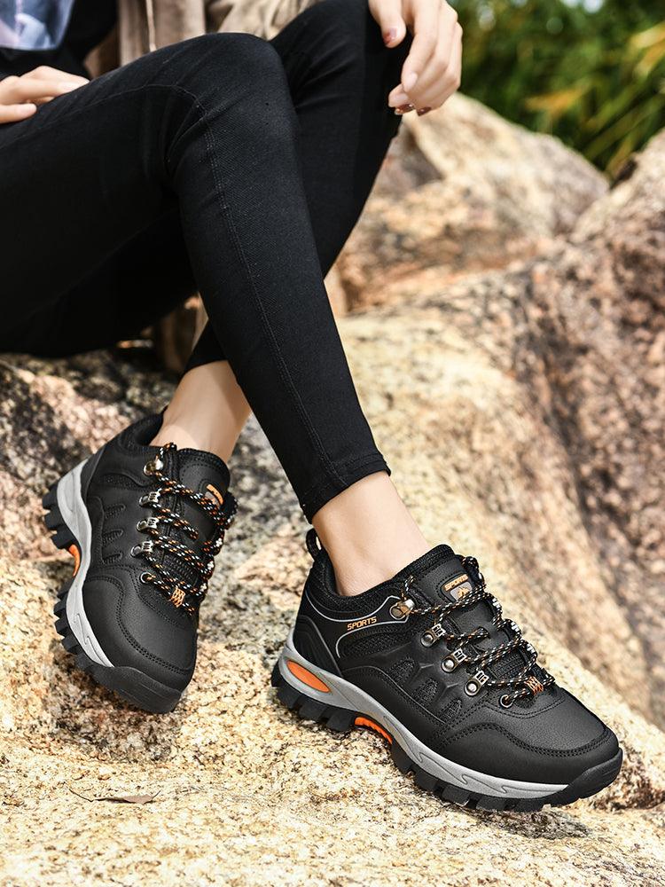 Hiking boots Stevvex men's waterproof pair with rugged black upper and orange details on Tampa Home & Garden Store
