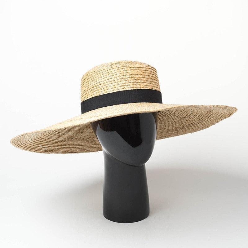 Oversized Stevvex straw sun hat with natural beige straw, wide brim and black ribbon band on Tampa Home & Garden Store