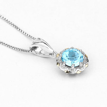 Pendant with 2.32ct Swiss blue topaz and white diamond halo in 14K yellow gold over .925 silver on Tampa Home & Garden Store