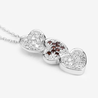 Three heart diamond pendant in .925 sterling silver with red center diamonds by Bids.com on Tampa Home & Garden Store