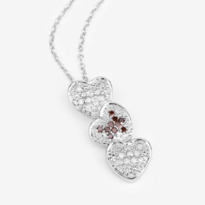 Three-heart pendant in sterling silver with white diamonds and red diamond accents on Tampa Home & Garden Store