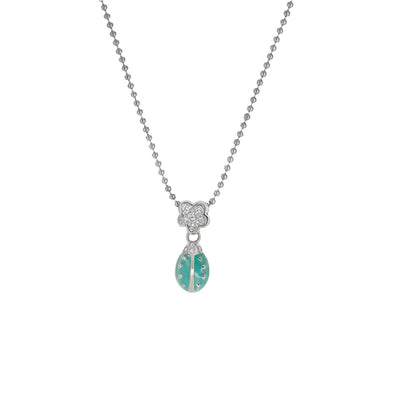Lady Poof Necklace silver-tone chain with floral charm and turquoise drop pendant on Tampa Home & Garden Store
