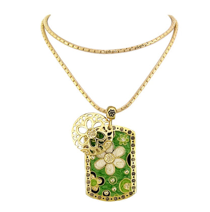 Art Deco pendant necklace with gold-tone daisy filigree and green enamel panel by Lauren G Adams on Tampa Home & Garden Store