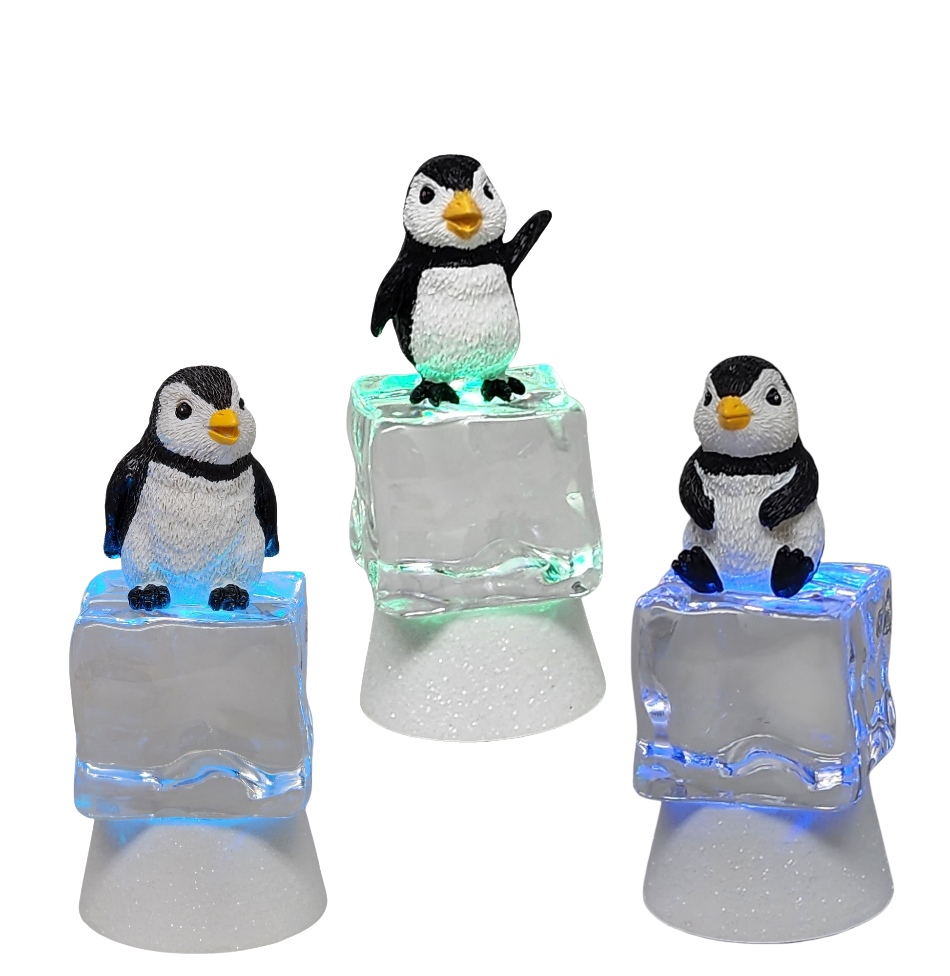 Five penguin figurines perched on frosty ice cube bases with color-changing LED lighting on Tampa Home & Garden Store