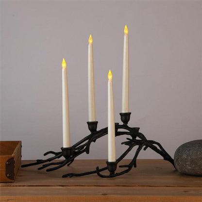 Flameless LED taper candles four ivory candles on black iron candelabra with flicker on Tampa Home & Garden Store