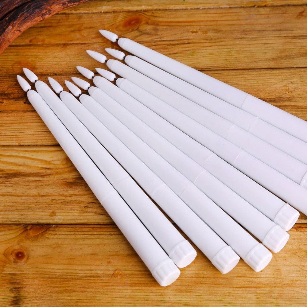 Stevvex 12-pack white plastic flameless LED taper candles with 3D wicks on wood surface on Tampa Home & Garden Store