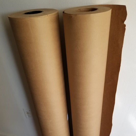 Garden paper weed barrier roll, green method compared to plastic or fabric weed barrier. Rolls of paper easier than cardboard for gardens.