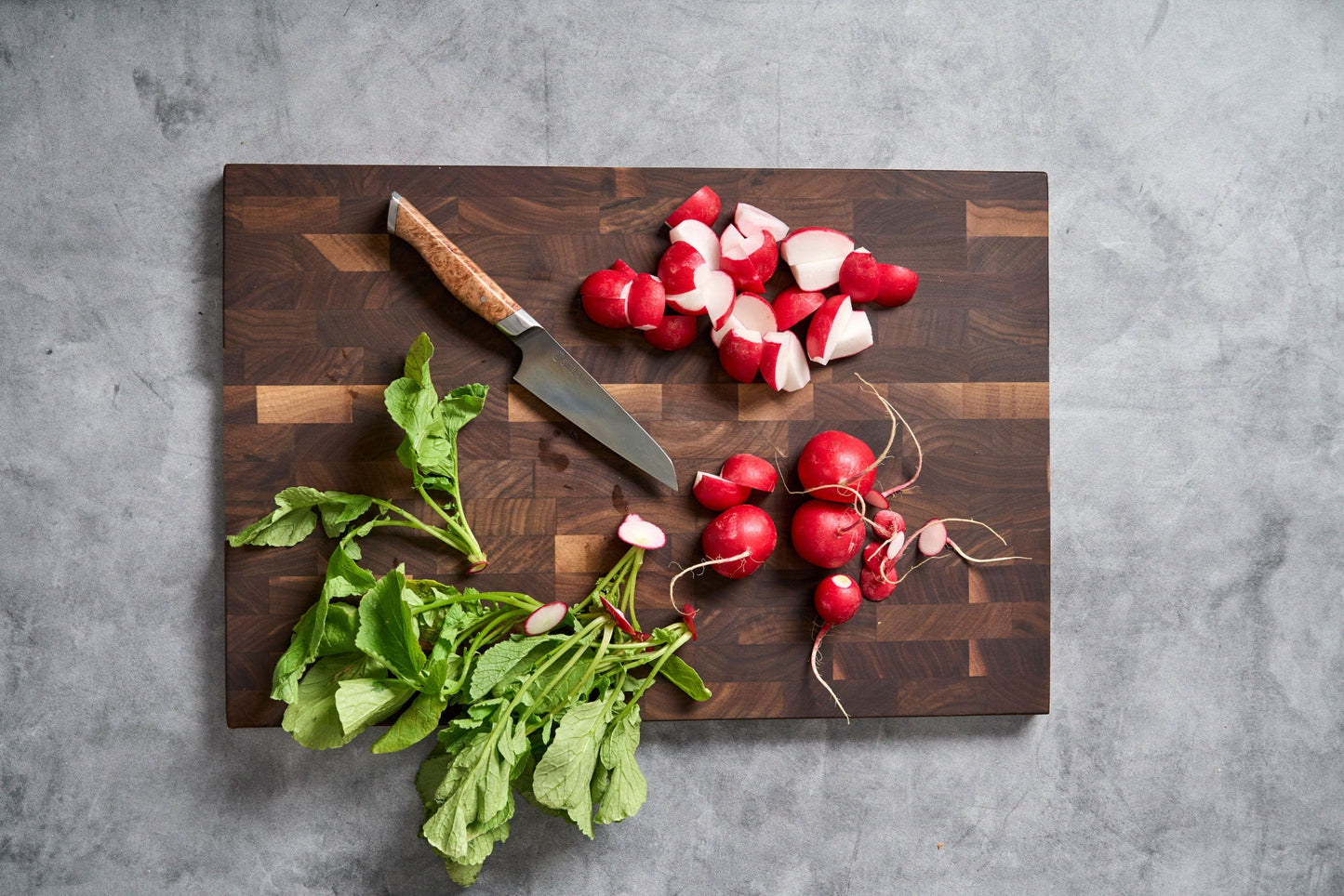 SteelCore 2-in-1 Walnut Cutting Board 18x12 with knife and radishes on dark wood board on Tampa Home & Garden Store