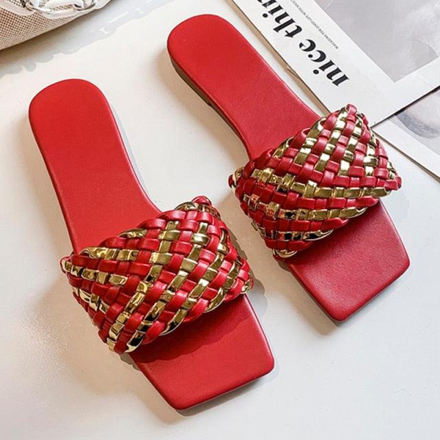 Pair of red braided strap flat sandals for women with gold accents open-toe slip-ons on Tampa Home & Garden Store