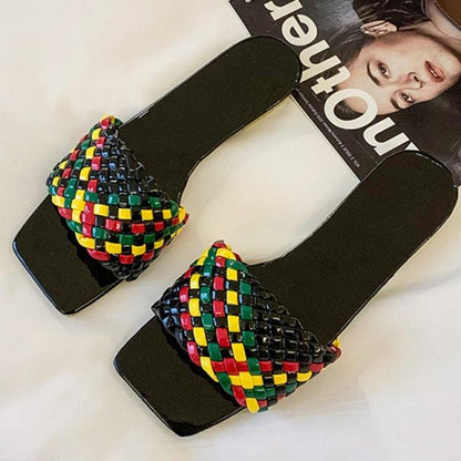 Stevvex pair of black flat sandals with a colorful braided strap, open-toe slide on Tampa Home & Garden Store