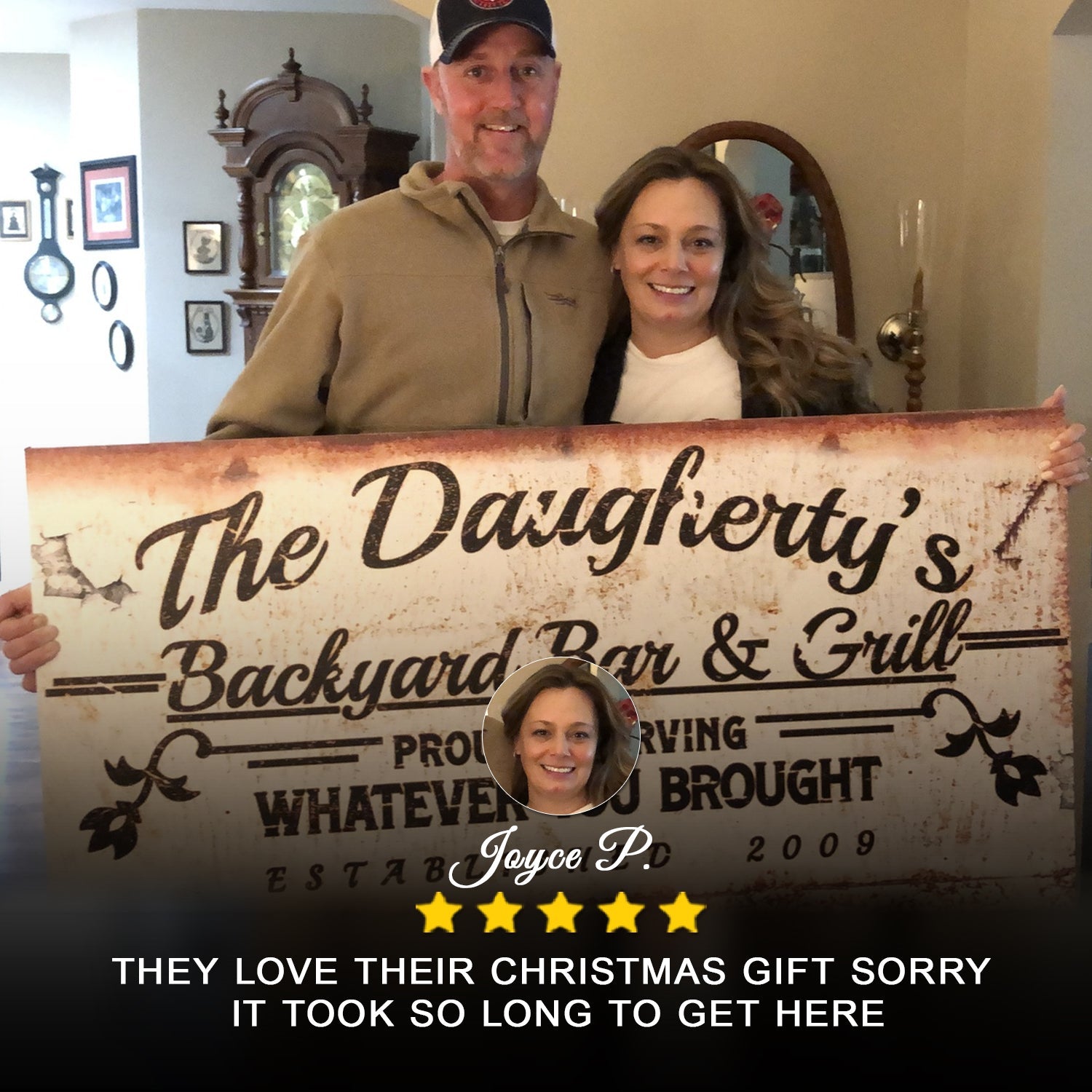Backyard Bar & Grill Sign II canvas with rustic brown typography held by a smiling couple indoors on Tampa Home & Garden Store